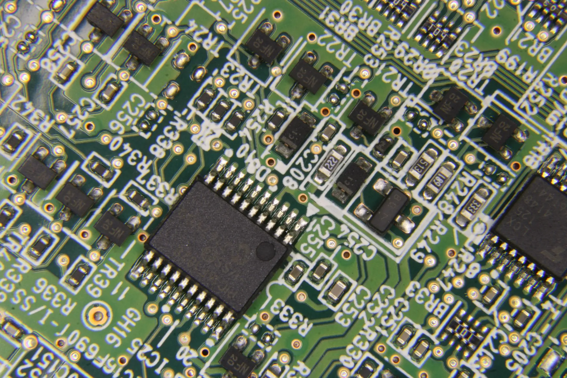 Close-up of a green circuit board with chips