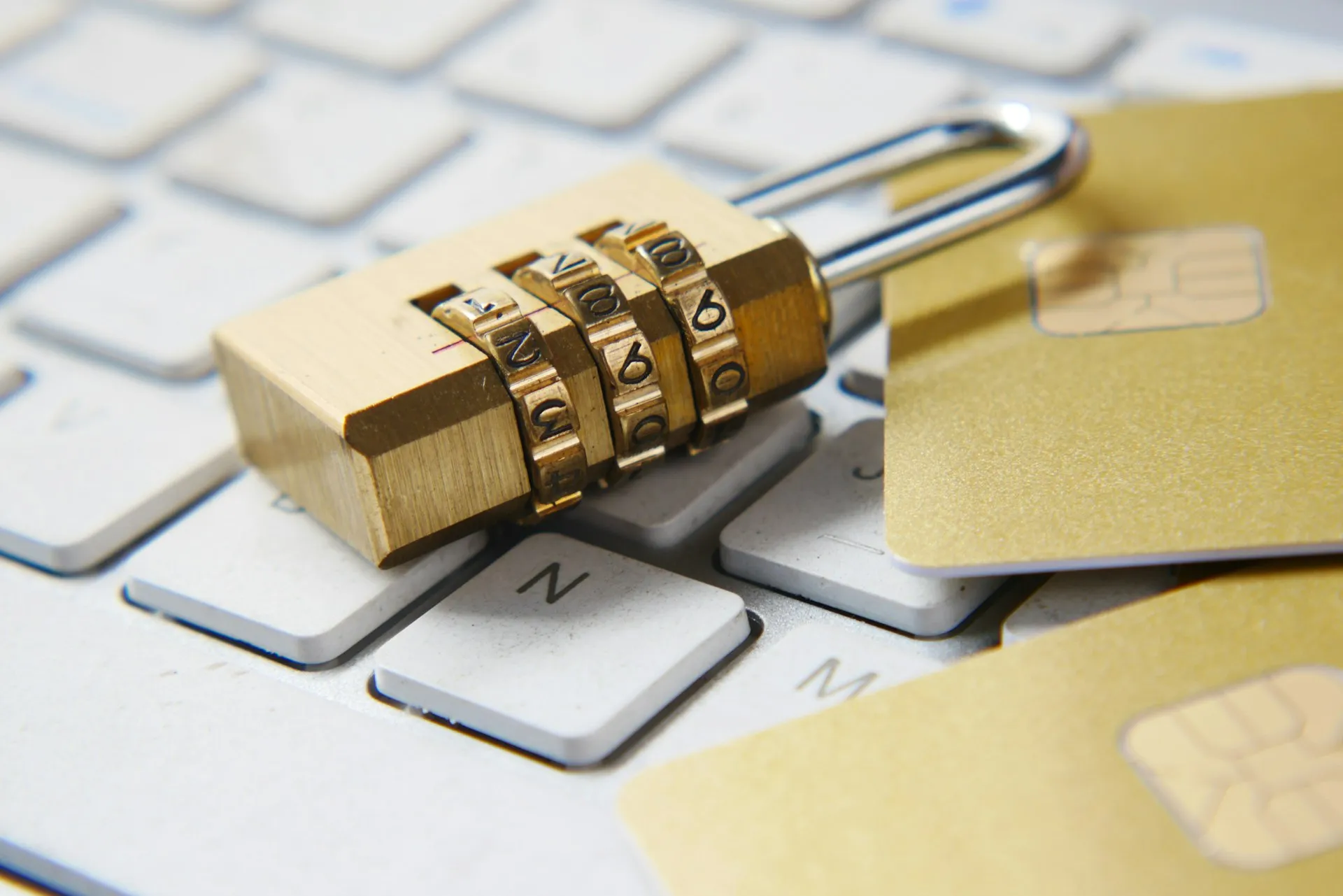 Combination padlock and chip cards on a laptop keyboard
