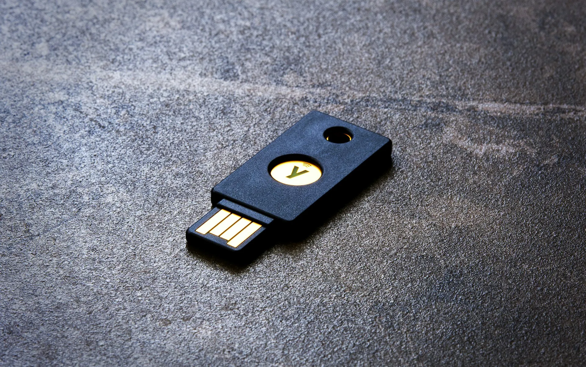 Hardware security key on a stone desk